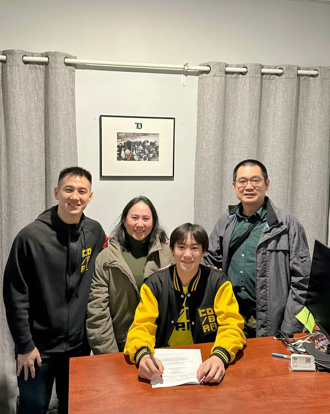 A Golden Cobras player signing with a team in North America