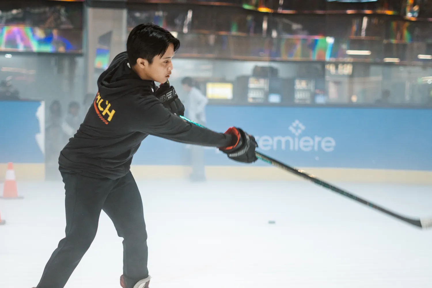 A coach demonstrating a shot
